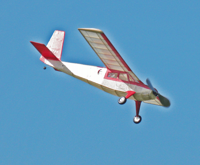 Scale Helio Courier in flight